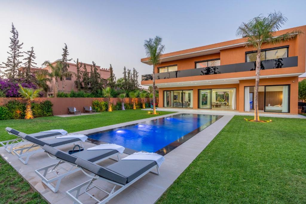 an image of a house with a swimming pool at Villa Mareva & Spa Marrakech in Marrakesh