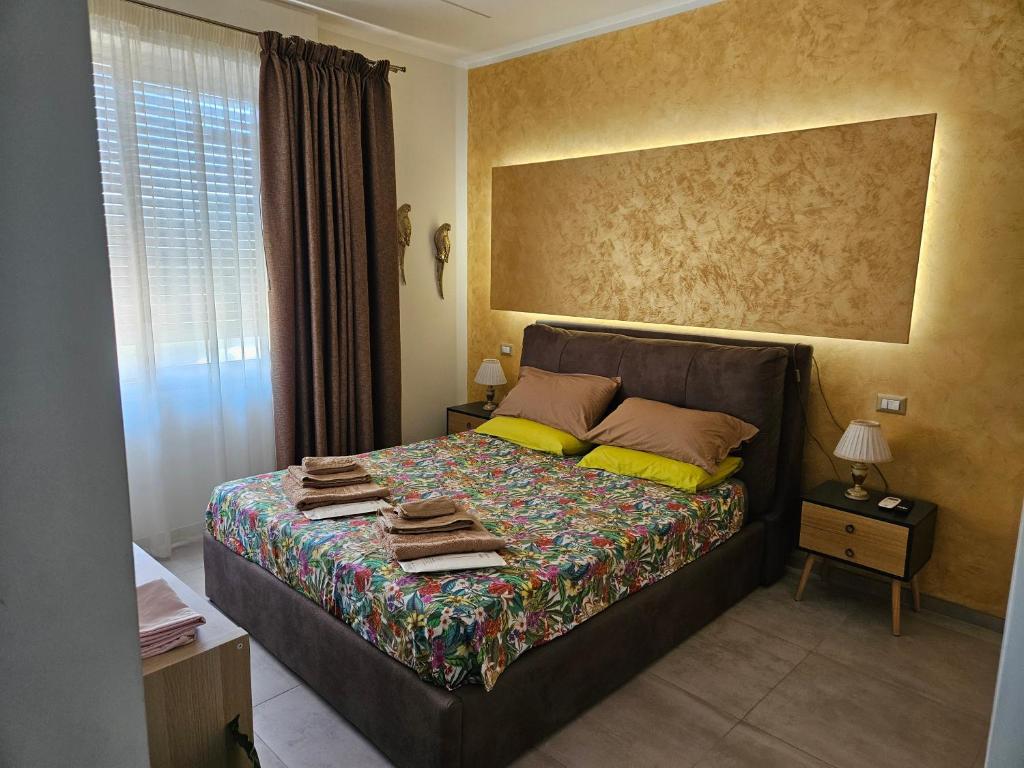 a bedroom with a bed with towels on it at L'Anfora in Montesilvano