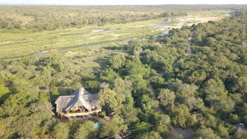 an aerial view of a house with a roof at Kruger Riverside Lodge - No Load-shedding in Marloth Park