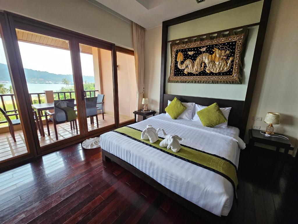 Ένα ή περισσότερα κρεβάτια σε δωμάτιο στο 2Bed Condo Seaview Koh Chang