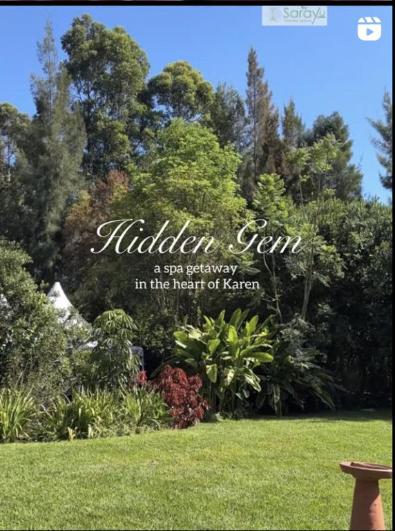 a sign for a spa garden in the heart of kennett at Sarayu Wellness Institute in Nairobi