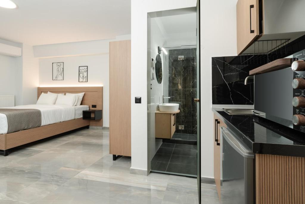 Ένα ή περισσότερα κρεβάτια σε δωμάτιο στο TOWER 15 Suites, Nilie Hospitality MGMT