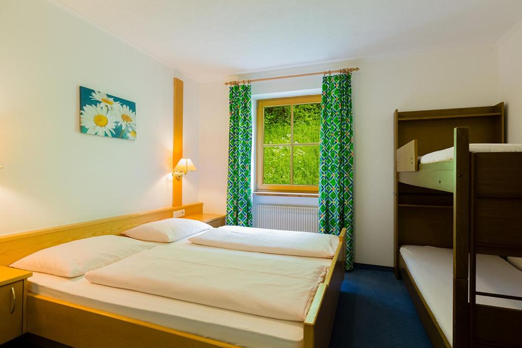 Postel nebo postele na pokoji v ubytování Garni Bergland
