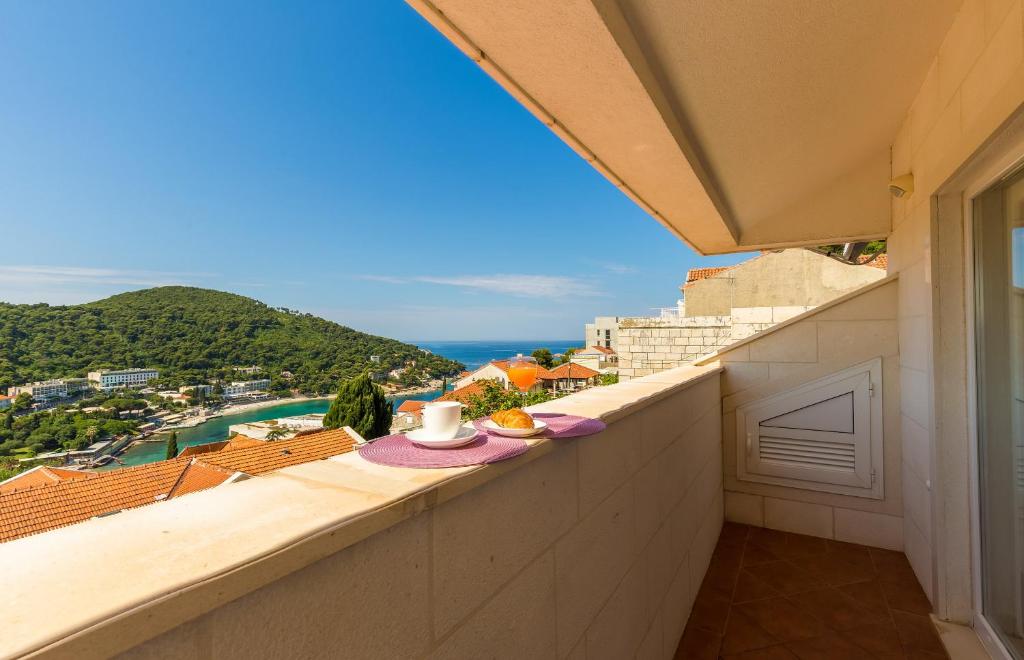 a balcony with a view of the ocean at Apartments Margaretic in Dubrovnik