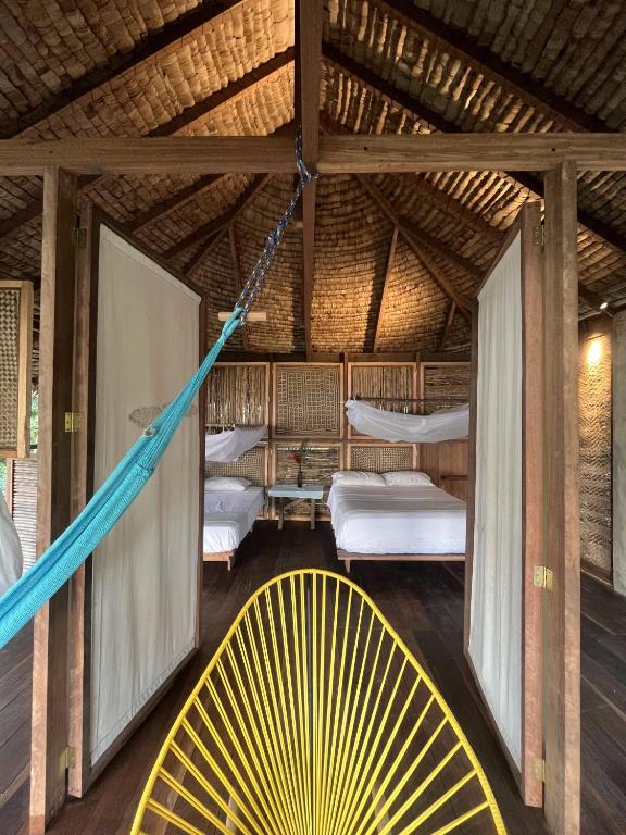 Ένα ή περισσότερα κρεβάτια σε δωμάτιο στο Ecohotel Luzul