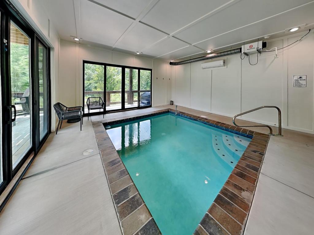 a swimming pool in the middle of a room at Smoky Ridge Sanctuary in Sevierville