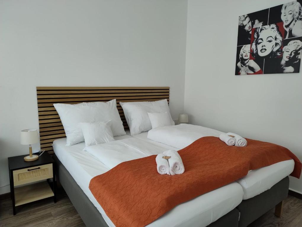 a bedroom with a bed with two towels on it at Stylish and Comfortable - Your Apartment in Vienna