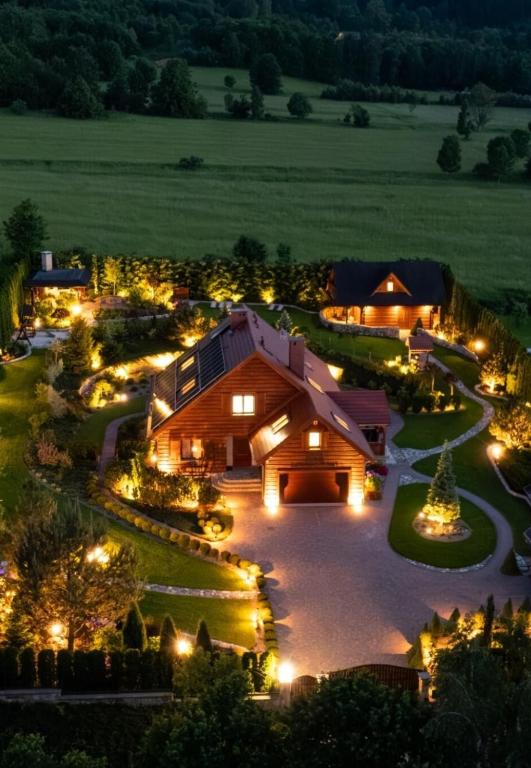 an aerial view of a barn at night at Karkonoski Klimat - apartamenty z widokiem na góry, dostępem do sauny, balii, jacuzzi oraz miejscem na grill i ognisko in Miłków