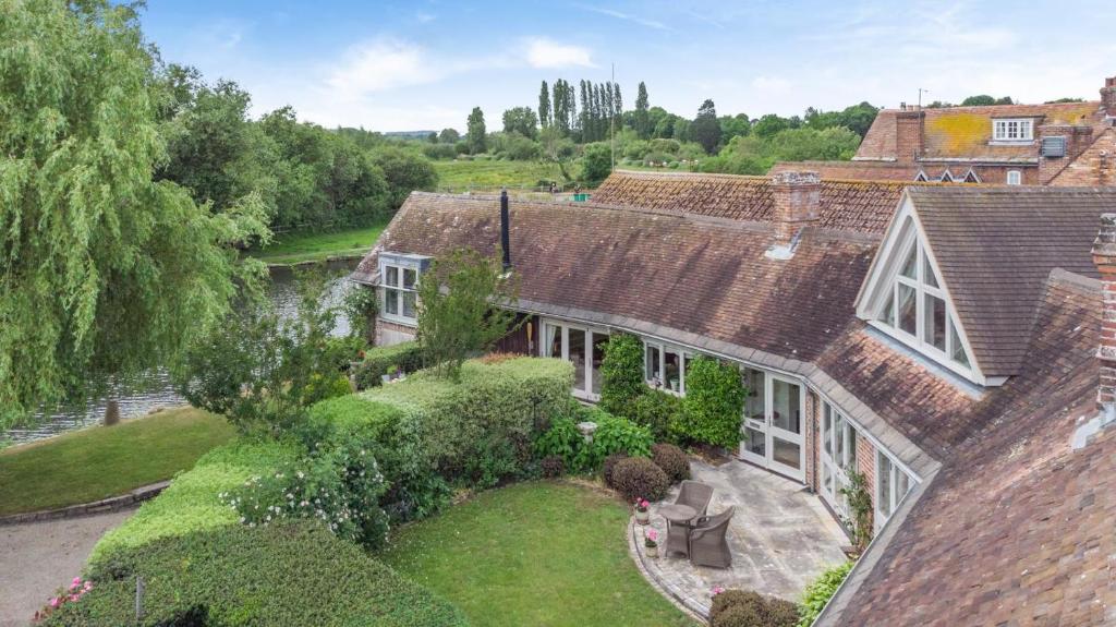 an aerial view of a house with a garden at Riverside Cottage - Wareham in Wareham