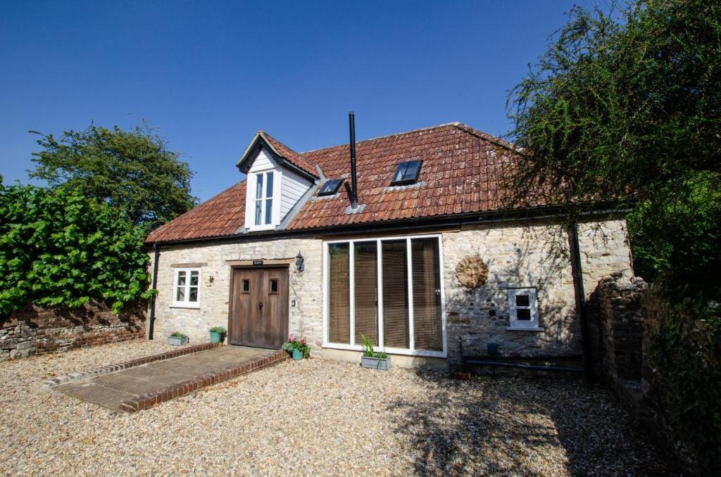 CharminsterにあるRuth'sの古い石造りのコテージ(木製のドア付)