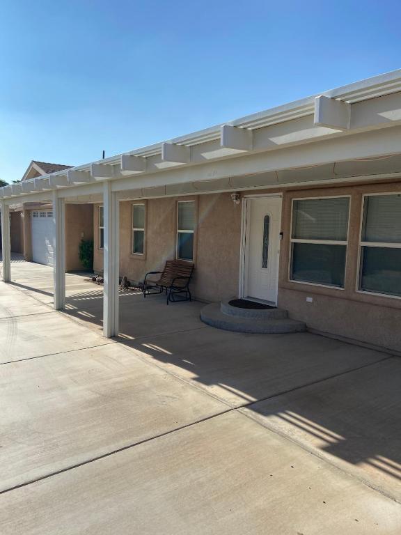 a patio of a house with awning on it at Parker Pair - Sunset Escape in Parker