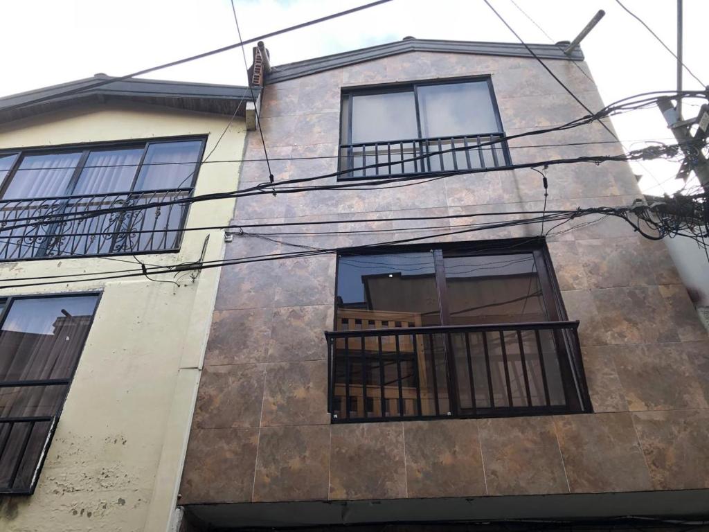 a building with balconies on the side of it at Apartamentos contiguos cerca a Parque de Bello Antioquia in Bello
