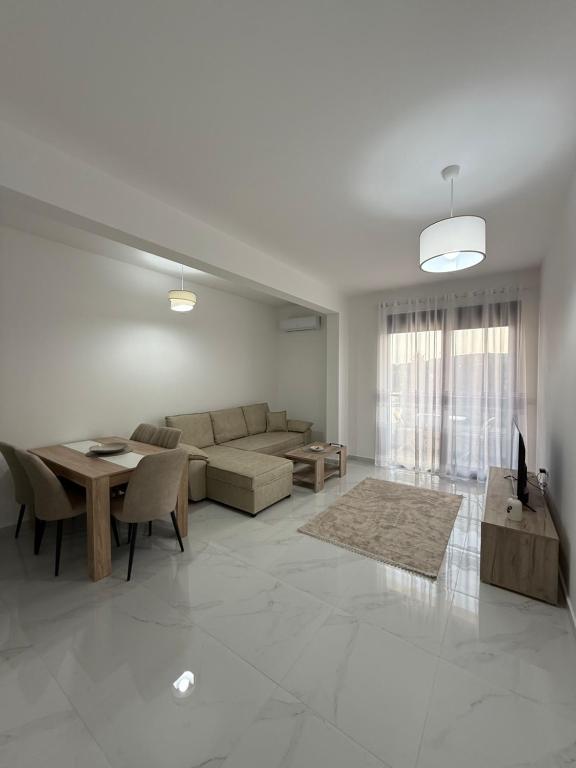 a living room with a couch and a table at FB Apartments in Ulcinj