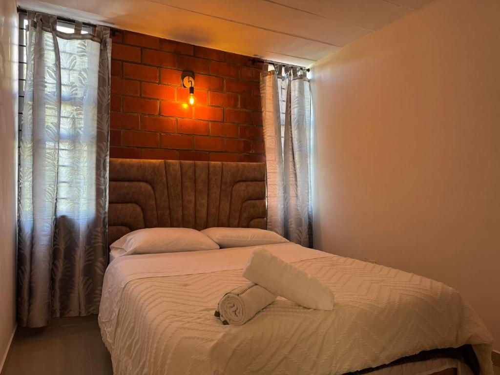 Postel nebo postele na pokoji v ubytování Casa Macrame El Carmen de Viboral