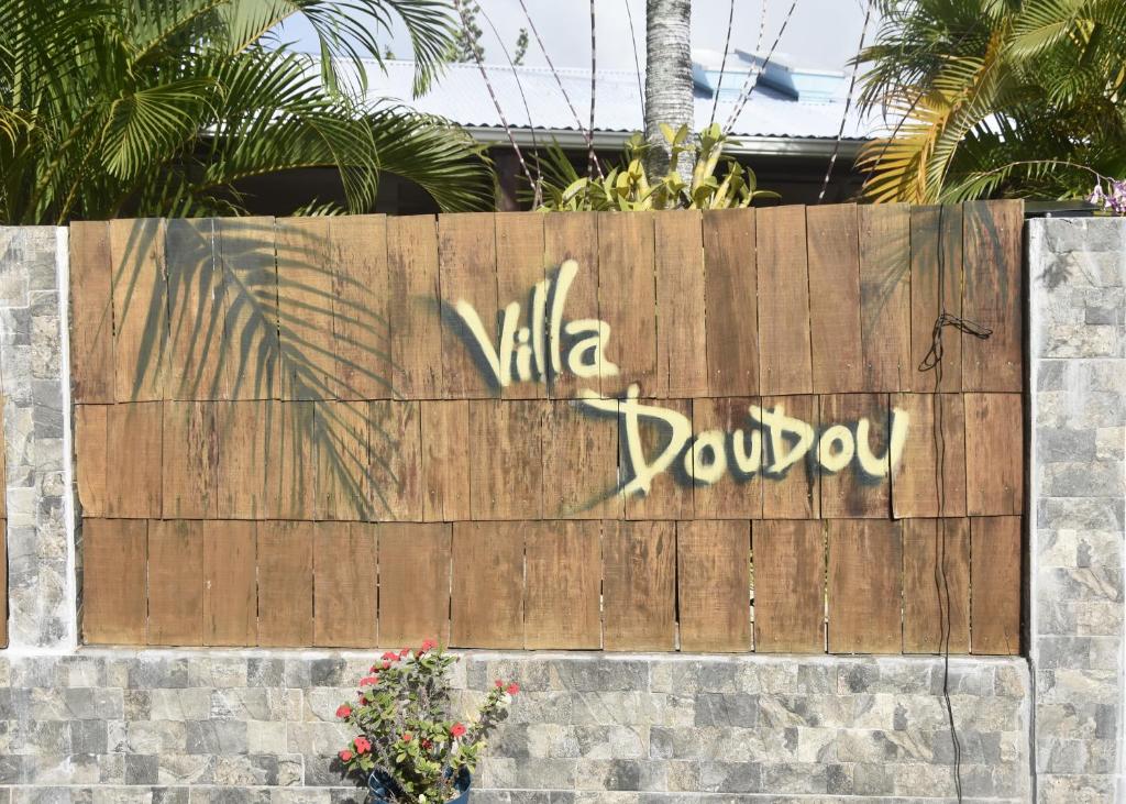 a wooden fence with the word valley rover written on it at Gite d'Arles "Villa Doudou" in Le Moule