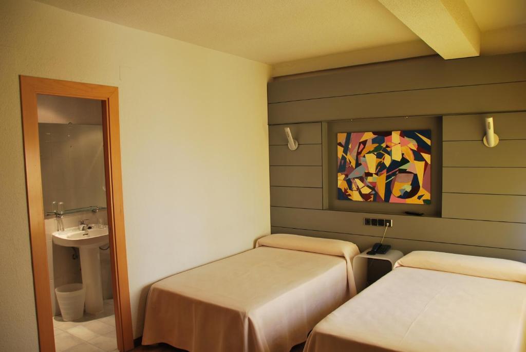 Postel nebo postele na pokoji v ubytování Hotel Trefacio