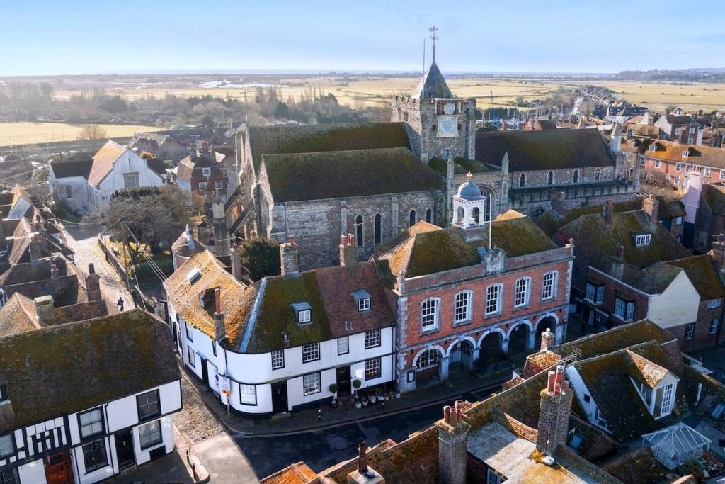 an aerial view of a town with a church at One Church Square in Rye