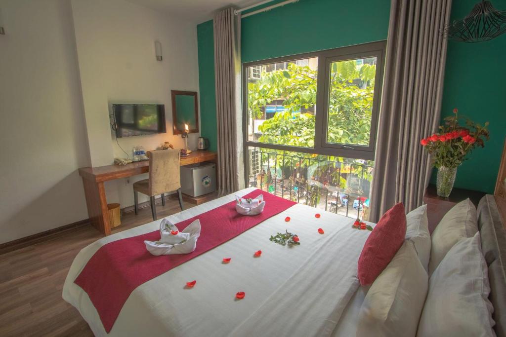 Postel nebo postele na pokoji v ubytování NT Elysian hotel