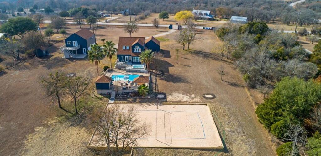 an aerial view of a house with a basketball court at Scenic 5-Acre Retreat with Hot Tub Pool & Game Room in Manor