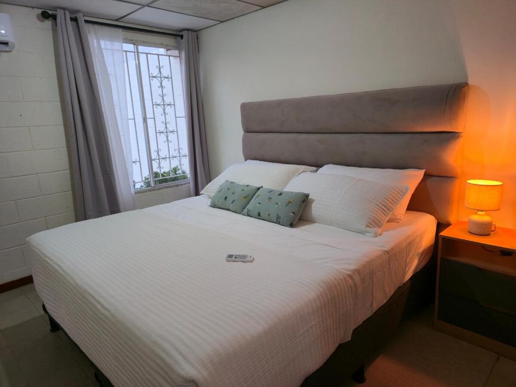 Ένα ή περισσότερα κρεβάτια σε δωμάτιο στο New House in Ciudad Merliot