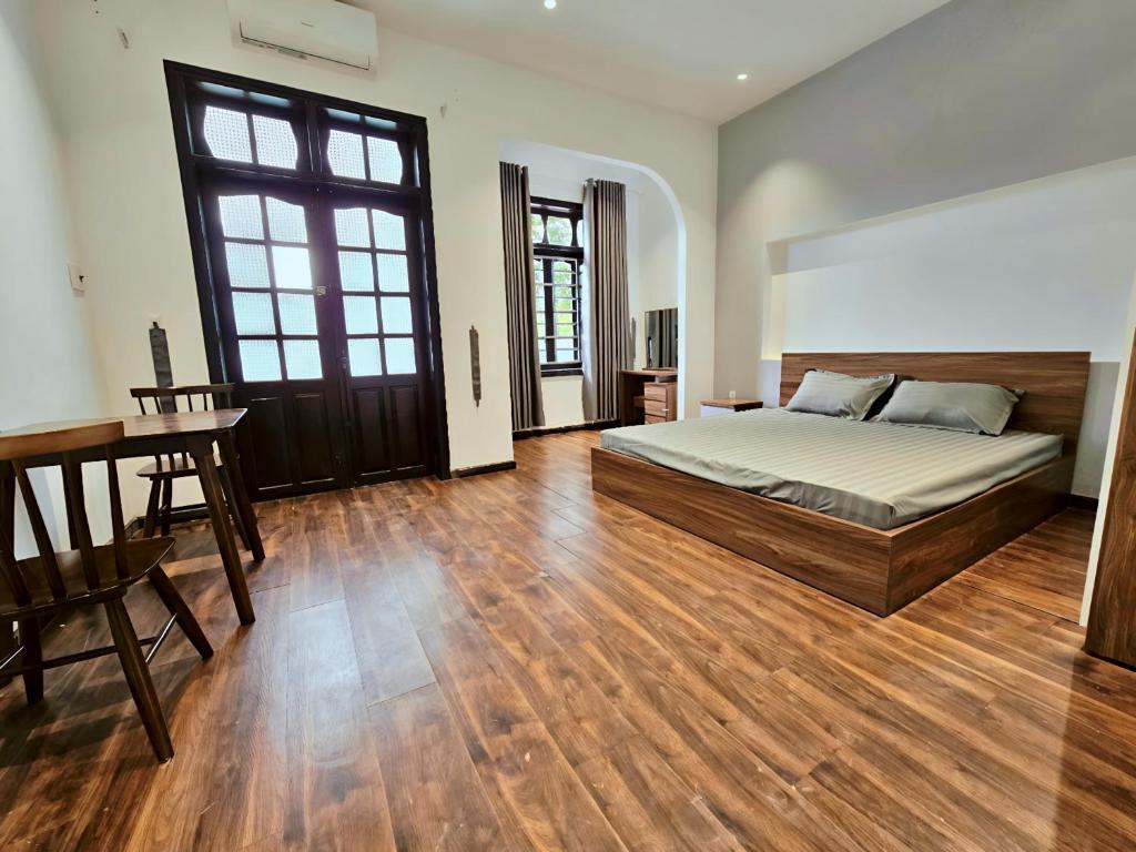 Ένα ή περισσότερα κρεβάτια σε δωμάτιο στο DN Apartment