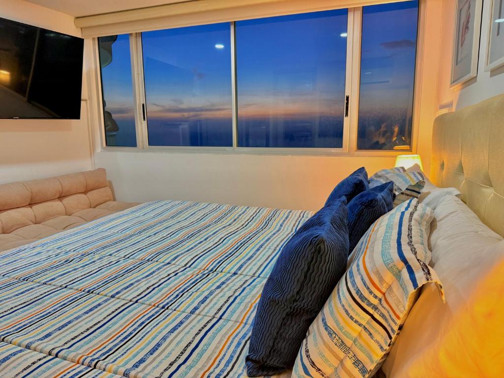 Postel nebo postele na pokoji v ubytování Piso 30 vista al mar, Palmetto 1 Bocagrande