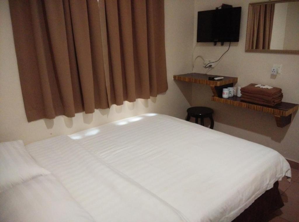 Postel nebo postele na pokoji v ubytování Hotel Traveller