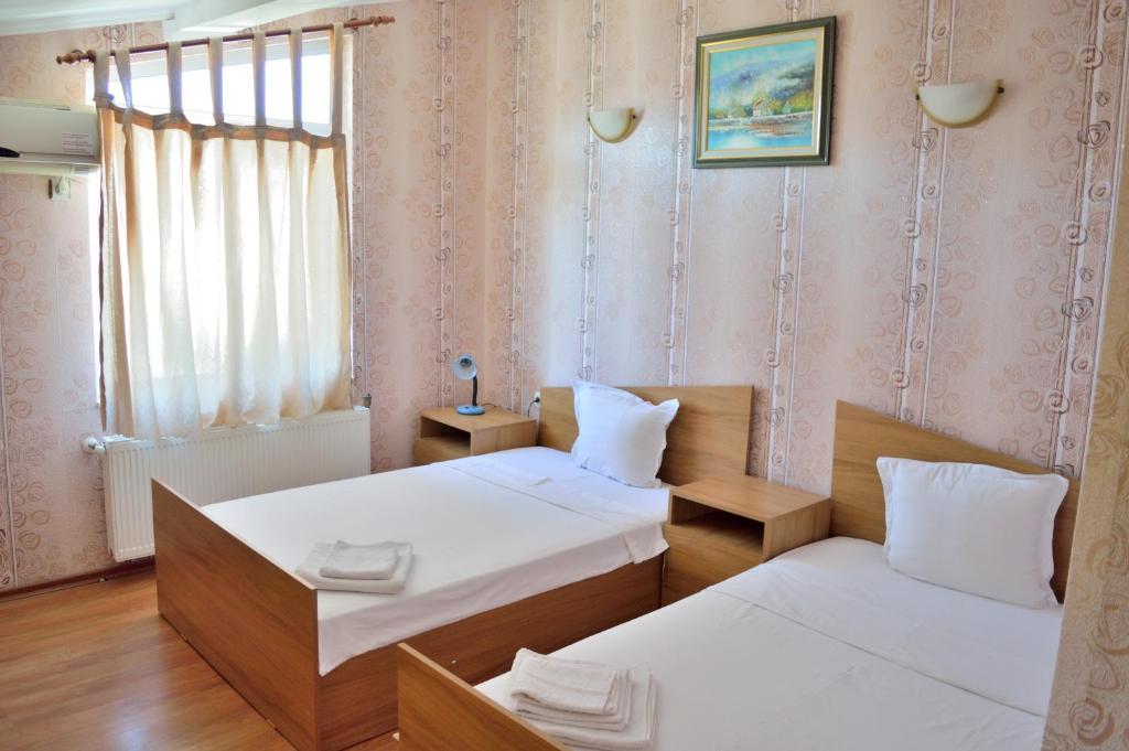 เตียงในห้องที่ Hotel Kibor