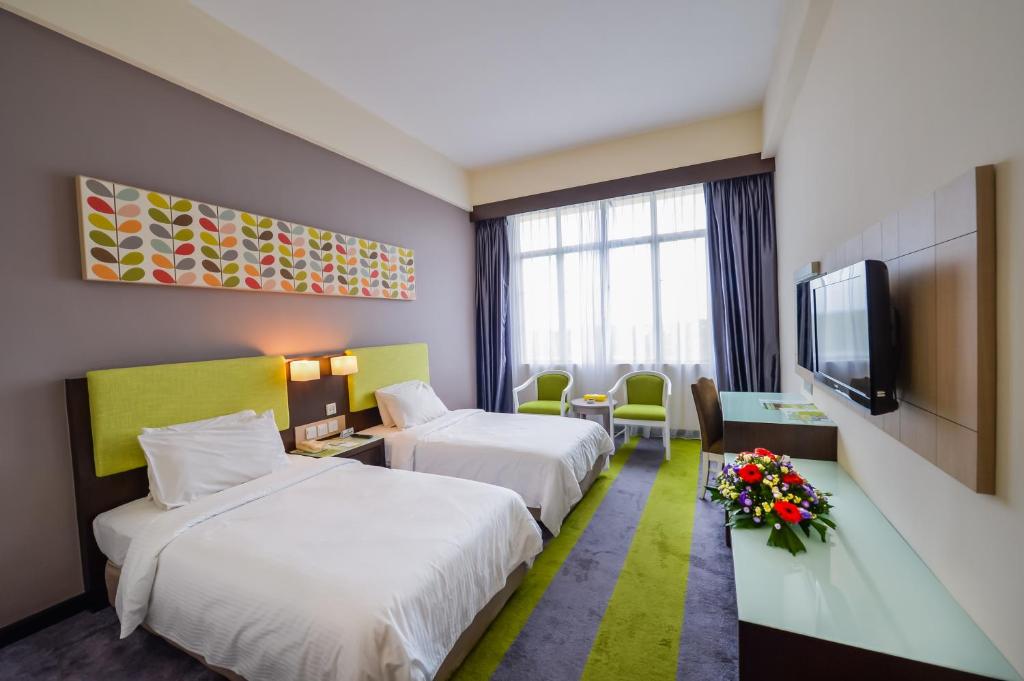 Postel nebo postele na pokoji v ubytování Mega View Hotel