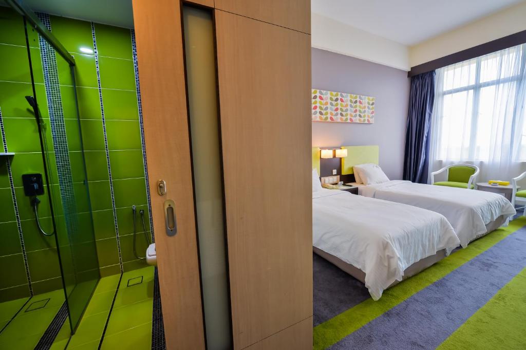 Postel nebo postele na pokoji v ubytování Mega View Hotel