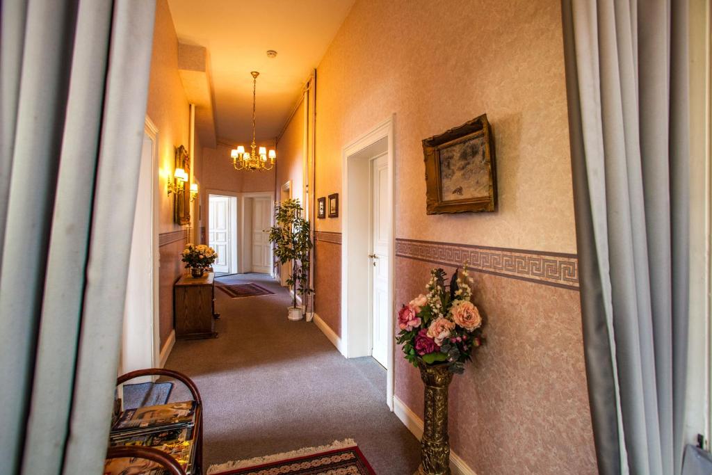 Postel nebo postele na pokoji v ubytování Hotel Rosenau