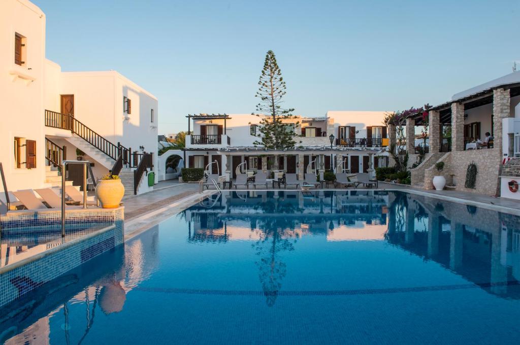 a large swimming pool in the middle of a building at Contaratos Beach Hotel in Naousa