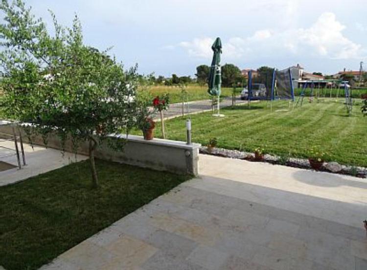 a park with a playground with a swing at Apartment Brno in Škatari