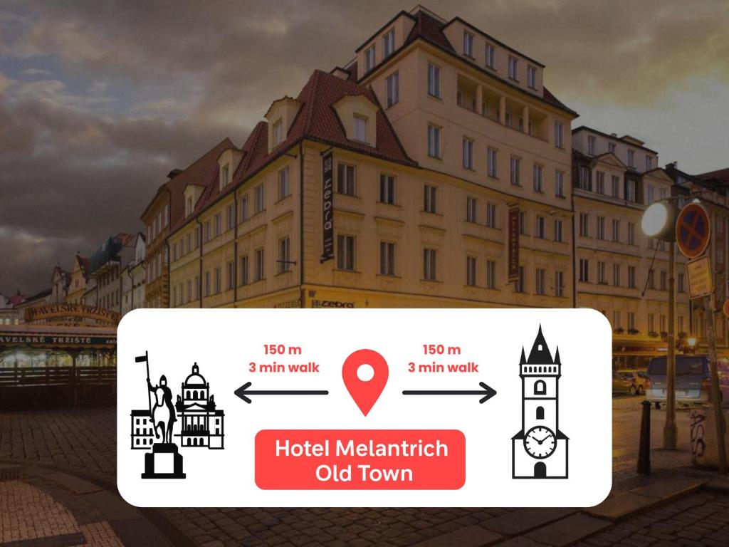 a sign in front of a building with a clock tower at Hotel Melantrich Old Town in Prague