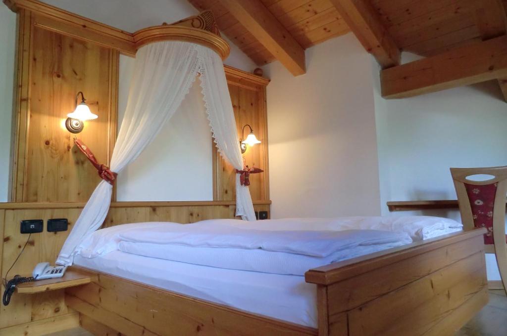 Postel nebo postele na pokoji v ubytování Garnì Costa Verde