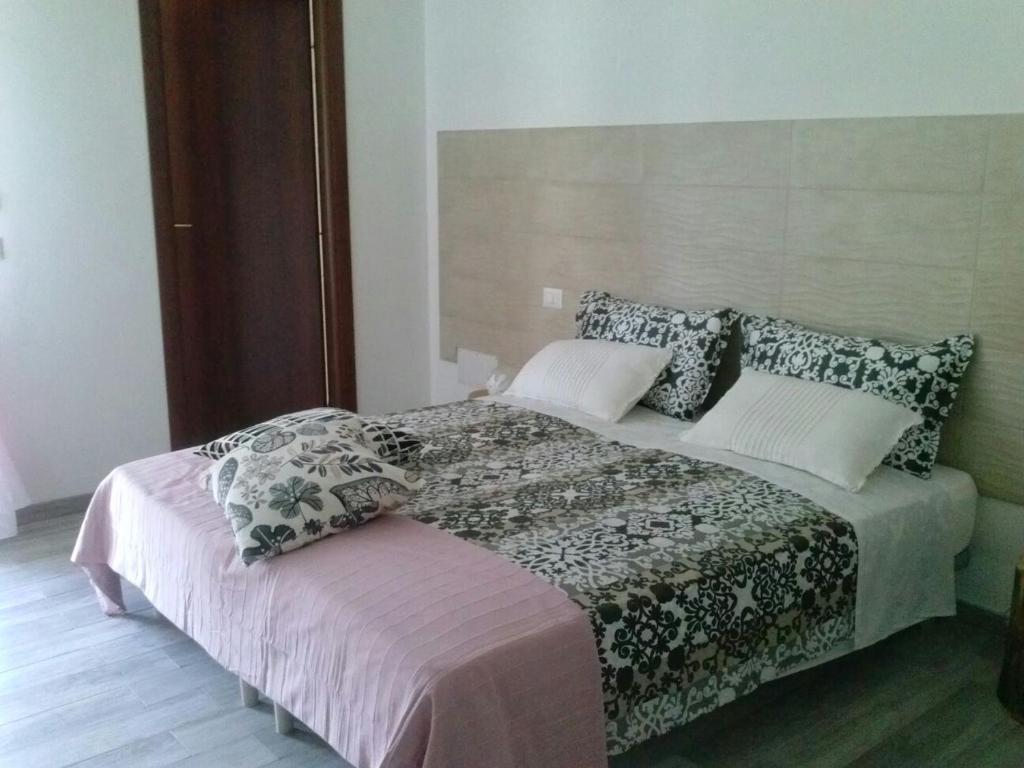 Een bed of bedden in een kamer bij B&B La Casa Bianca di Porto Conte