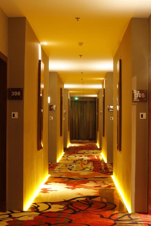 Postel nebo postele na pokoji v ubytování Royal Asnof Hotel Pekanbaru