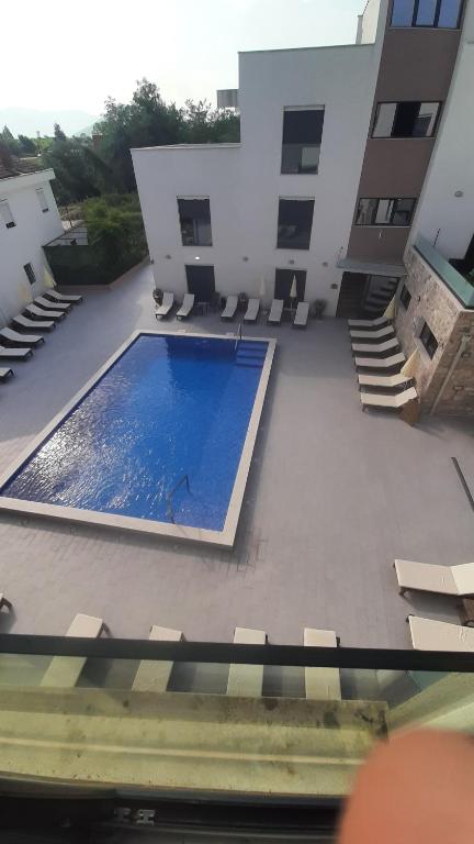 a swimming pool in the middle of a building at Apartment Cica in Igalo