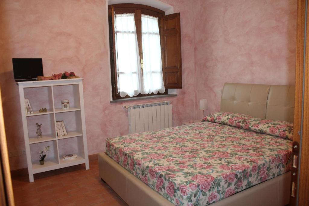 Postel nebo postele na pokoji v ubytování Lady Frantoio Toscano