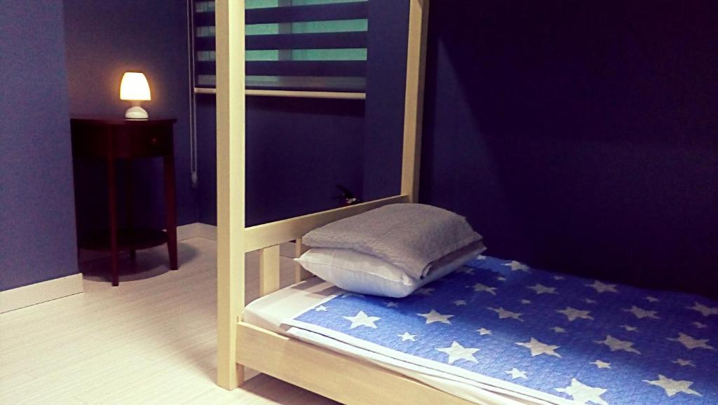 Postel nebo postele na pokoji v ubytování Cobe Guesthouse Dongdaemun