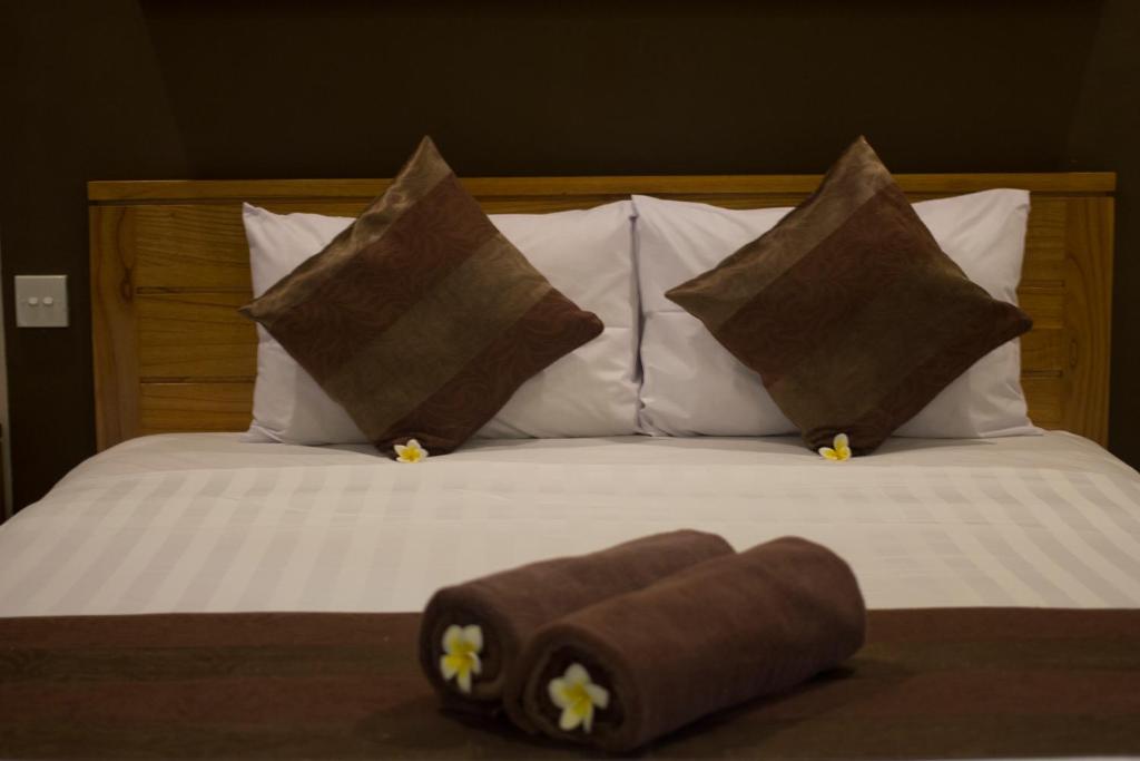 Postel nebo postele na pokoji v ubytování Bakung Sari Resort