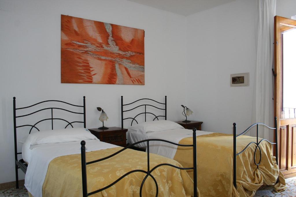 Postel nebo postele na pokoji v ubytování Hotel Tesoriero