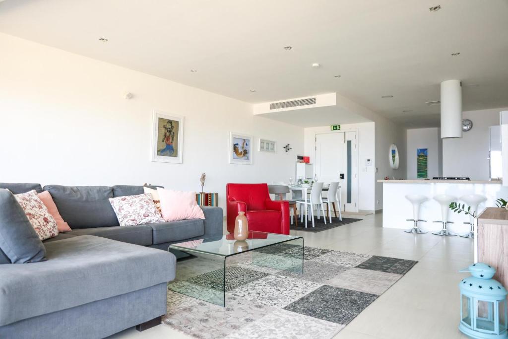 A seating area at Gorgeous 2BR Gozo Apt with private balcony & Pool by 360 Estates