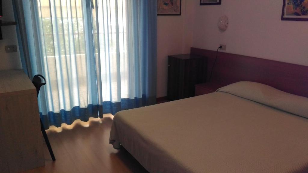 Postel nebo postele na pokoji v ubytování Hotel Meublè Villa Patrizia