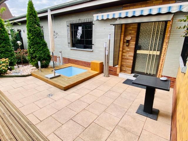 a patio with a small pool in front of a house at Wohlfühloase in Hofheim in Hofheim am Taunus