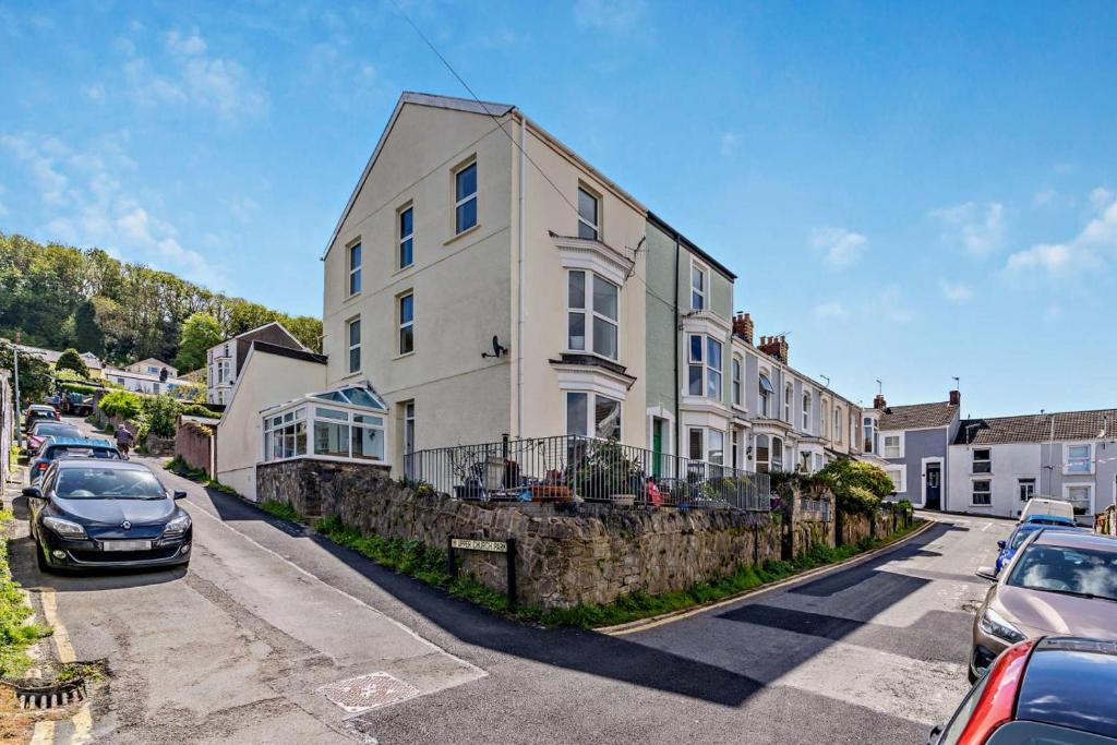 a large white house on the side of a street at Beechwood House in The Mumbles