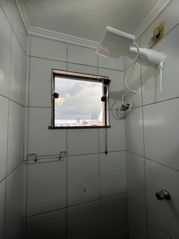 Et badeværelse på Apartamento Central em Alfenas