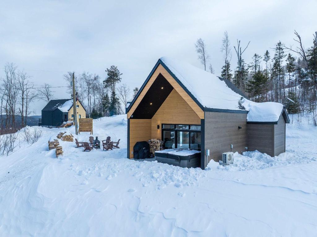 a cabin in the snow with snow covered ground at Spa and Mountain - Chalet OslO42 in Saint Come