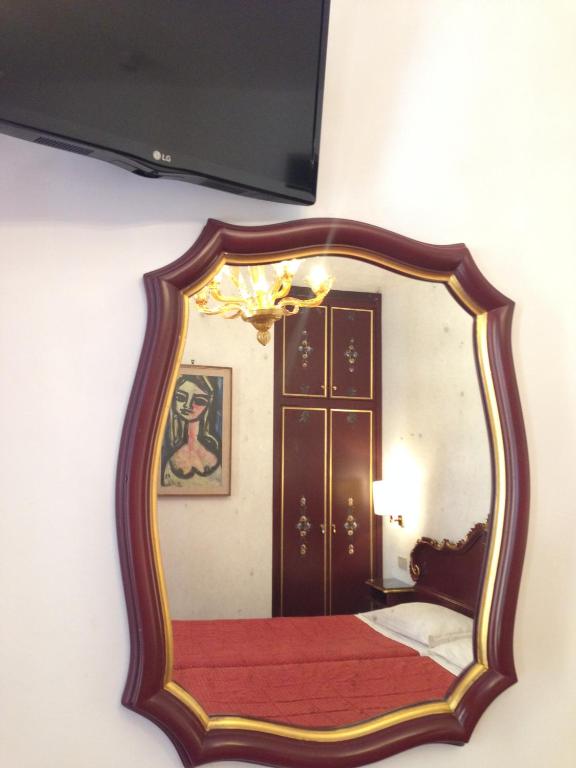 Postel nebo postele na pokoji v ubytování Hotel Serenissima