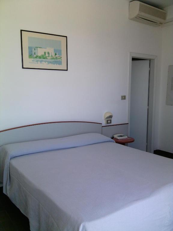 Postel nebo postele na pokoji v ubytování Hotel Boston